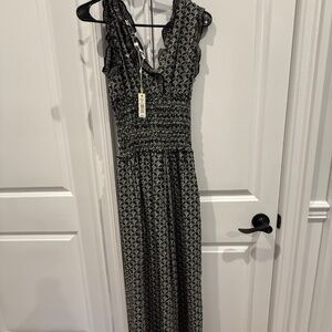 Chic Black and White Floral Print Smocked Maxi Dress